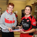 Méabh McGleenan receiving the Michaela Harte Award from Peter Harte